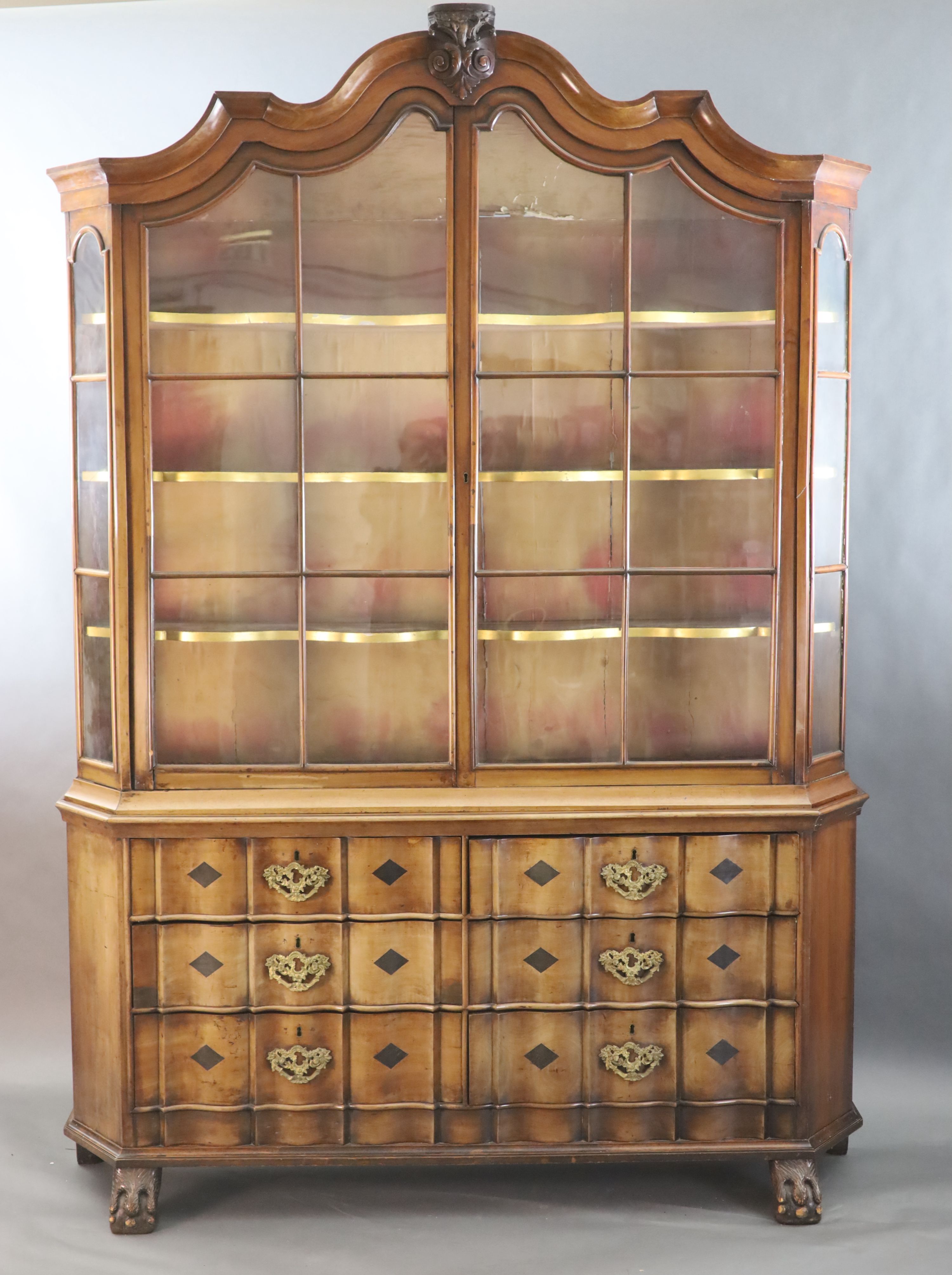 A late 18th century Dutch walnut serpentine vitrine, W.5ft 11in. D.1ft 4in. H.8ft 5in.